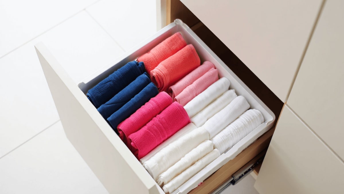 This Easy Kitchen Towel Folding Trick Frees Up Space In Shallow Drawers