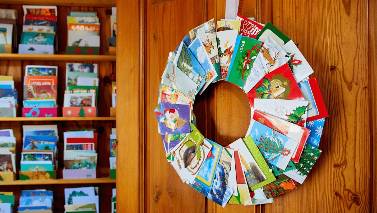 Don't Throw Out Old Christmas Cards! Turn Them Into The Most Creative Door Decor For Next Year