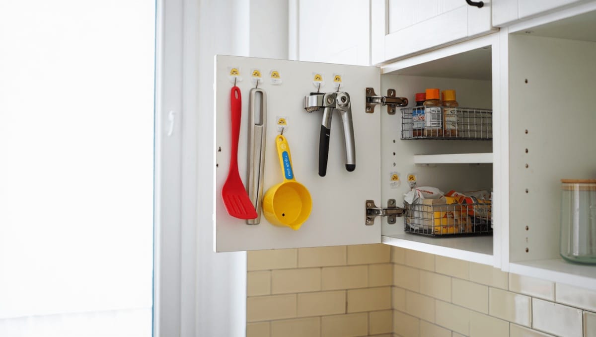 This Genius Dollar Tree Hack Turns Unused Cabinet Door Space Into Storage Gold