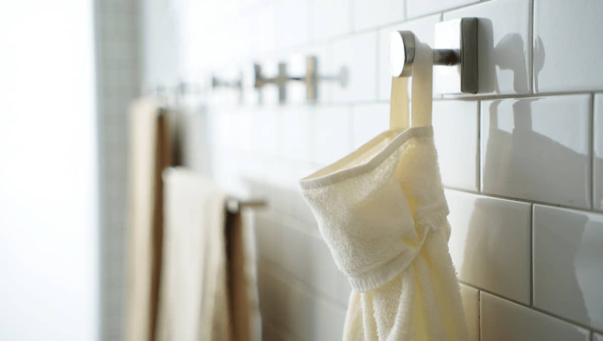 Ditch Messy Towel Hooks: A Cuter Way To Fold & Hang Bathroom Towels