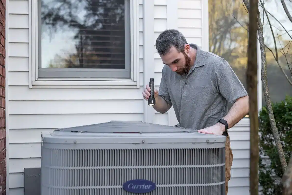 Dirty air filter being replaced with a clean one during home maintenance