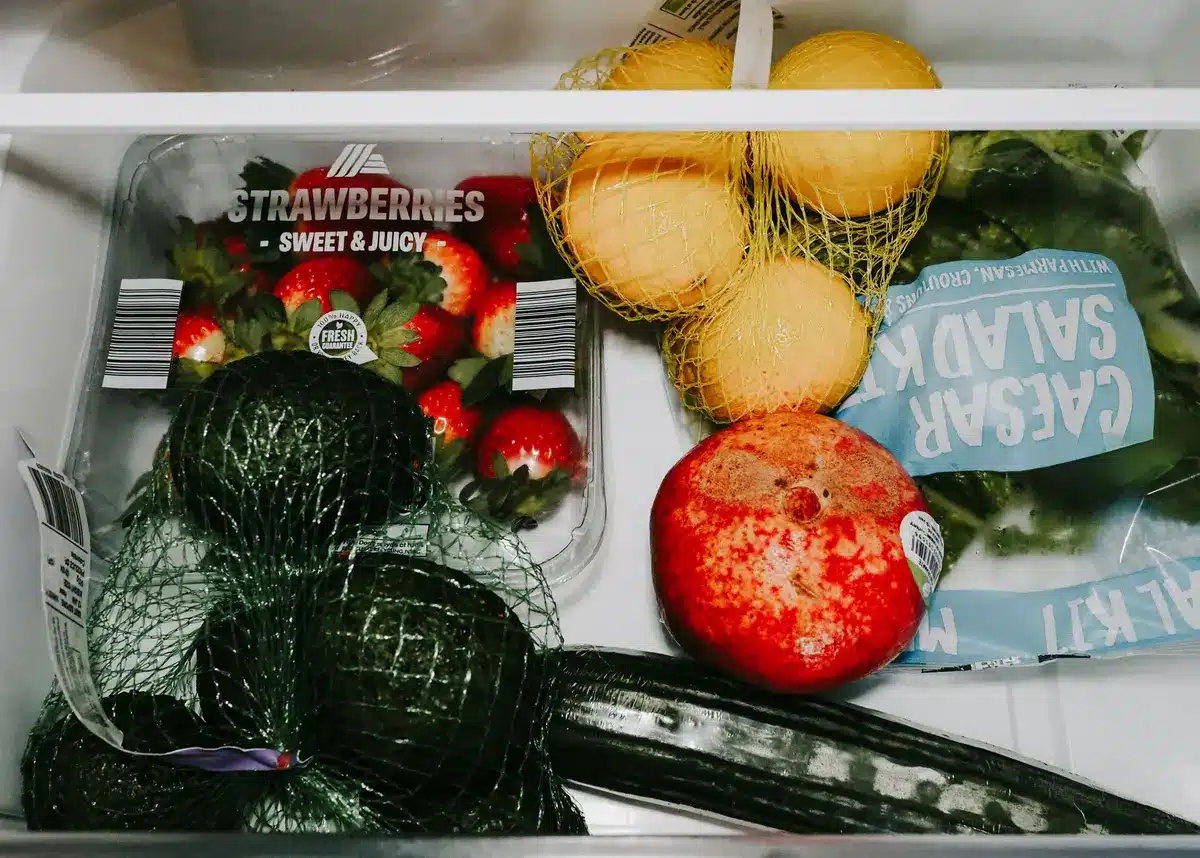 Fresh lemon halves and coffee grounds placed in a refrigerator to naturally freshen the air