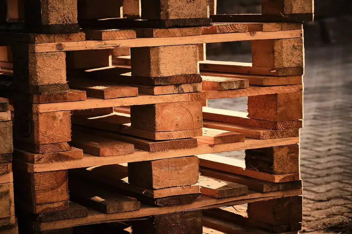 Stacked wooden pallets showing weathered wood grain and rustic texture