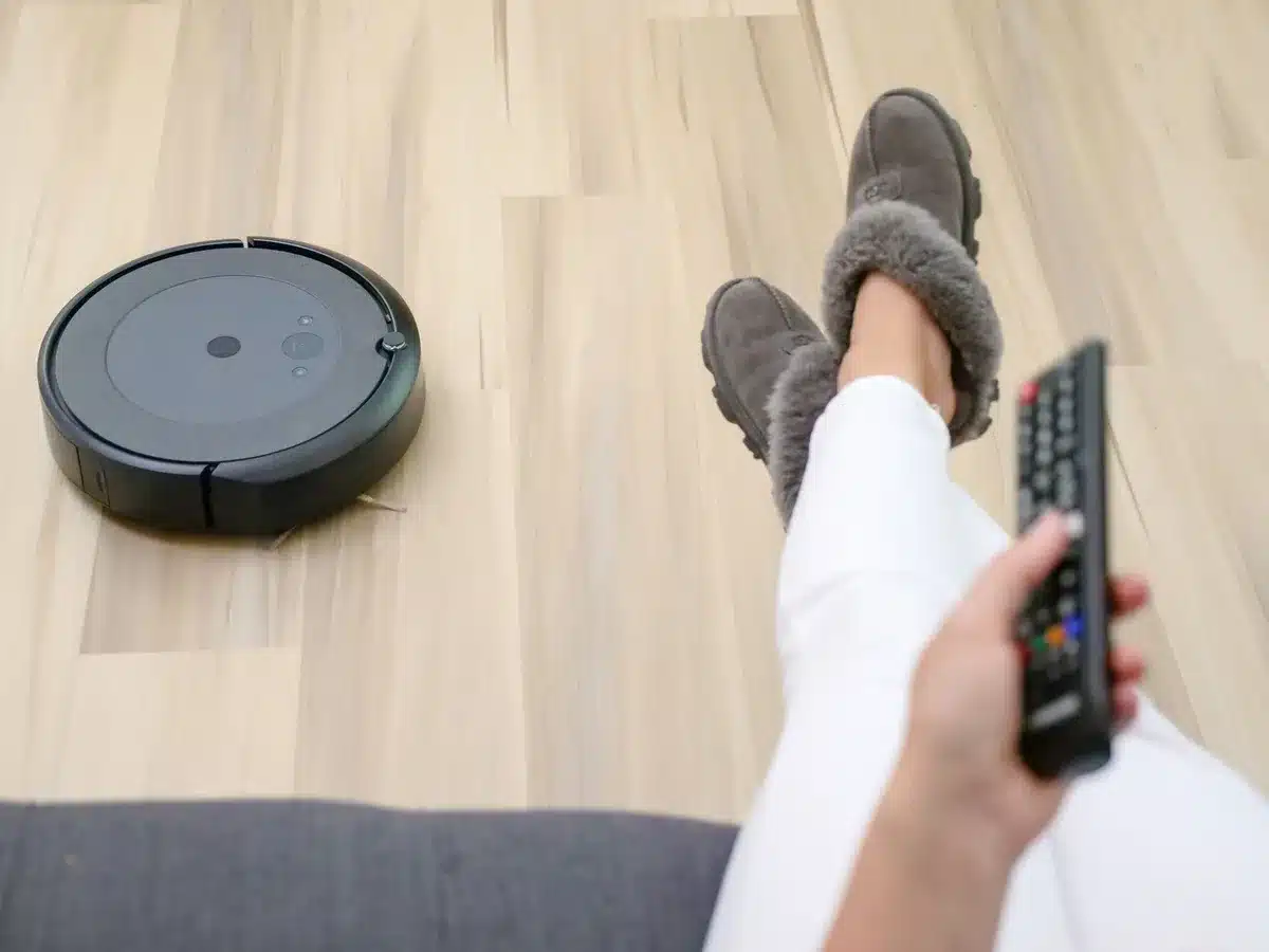 Robot vacuum operating autonomously on a living room floor