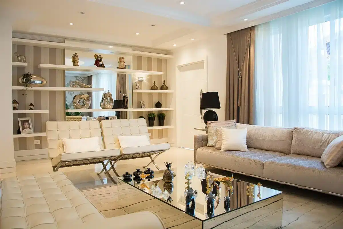 Styled interior showing fuzzy textile next to chrome furniture with geometric rug anchoring the seating area