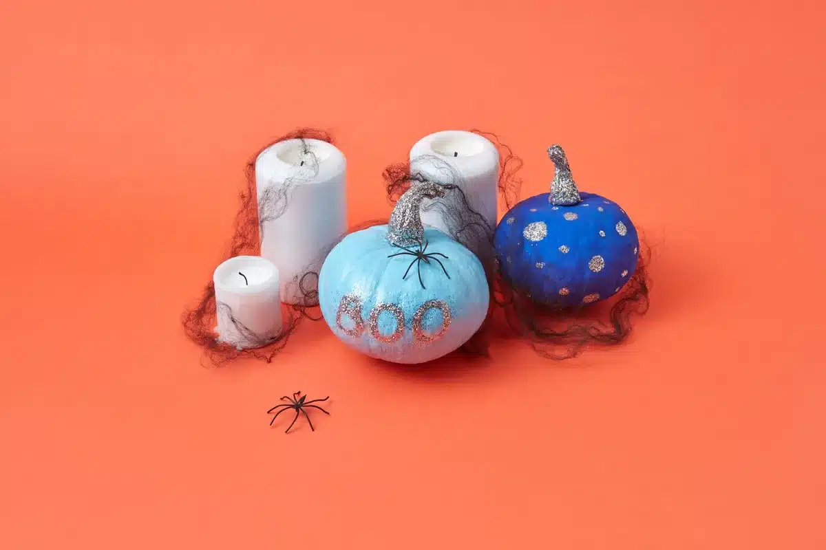 Detergent bottles painted orange and white to resemble pumpkins and ghosts