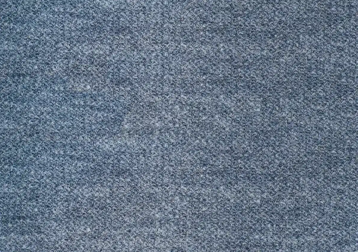 Close-up of polyester blend fabric showing its smooth, moisture-resistant texture