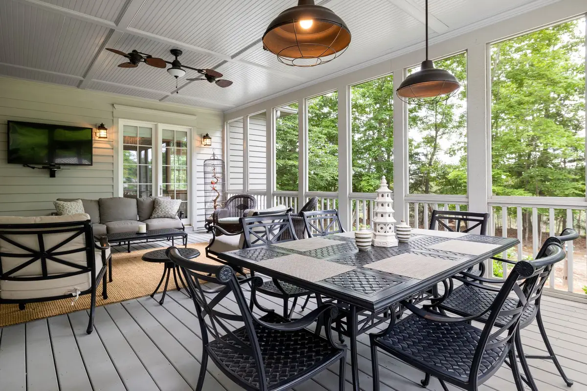 Spacious Southern room with tall ceilings and wraparound porch allowing natural light