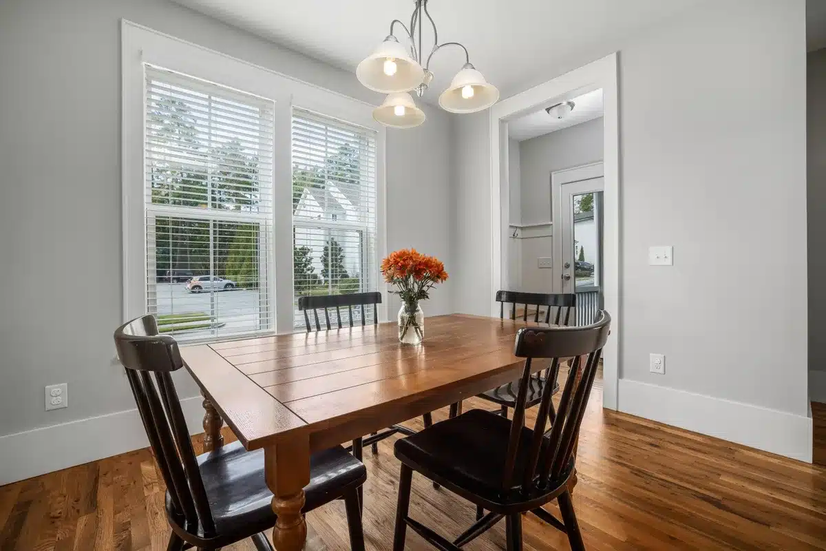 Bright room with natural light flowing through a small upper window above a doorway