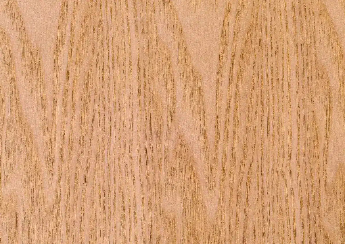 Close-up of hand dry-brushing darker paint over textured surface to create woodgrain