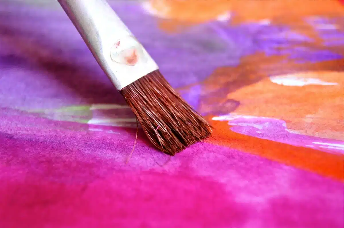 Paint color swatches and supplies on a counter at a home improvement store
