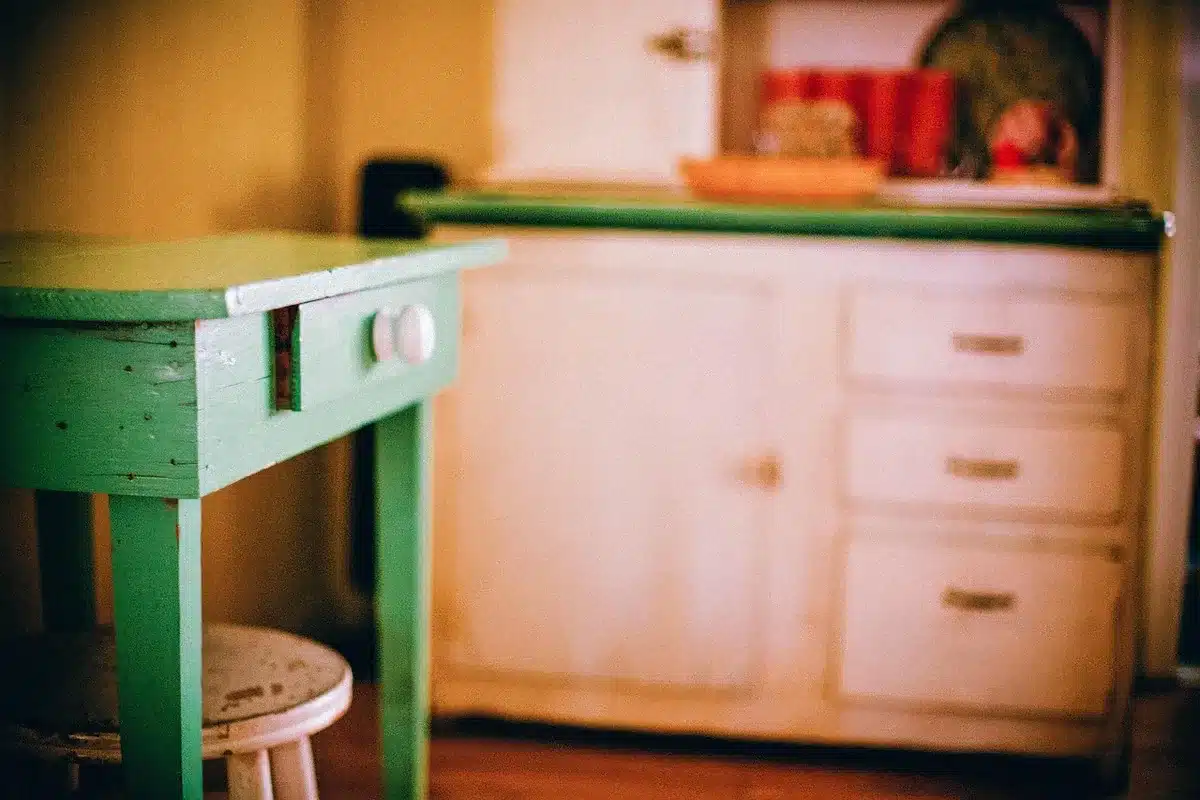 Cabinet door with shallow framed squares attached to center panel to mimic small drawer fronts