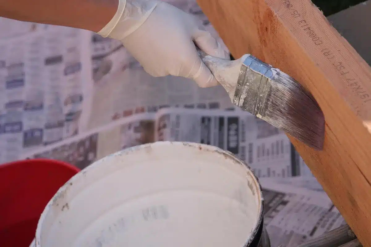 Small towel ring being wrapped and sealed beside a bathroom sink