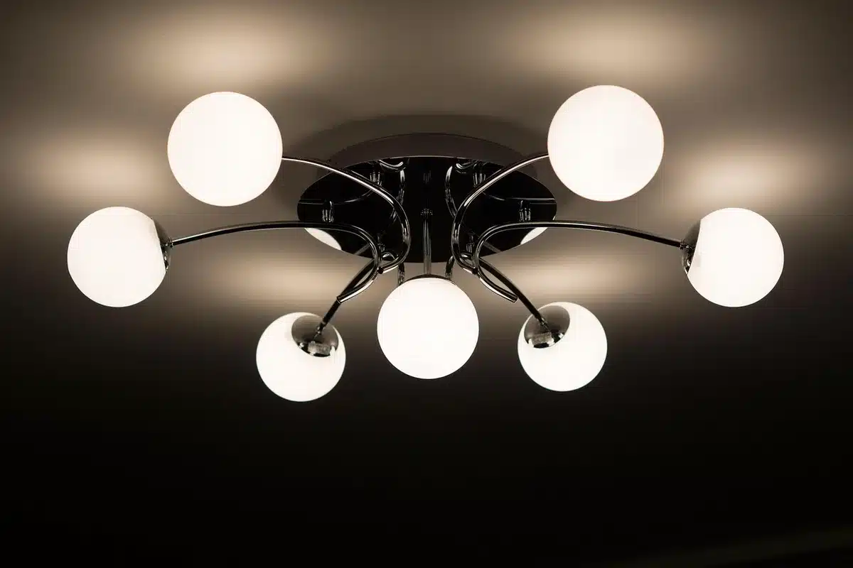 Motion-activated porch light fixture mounted above doorway