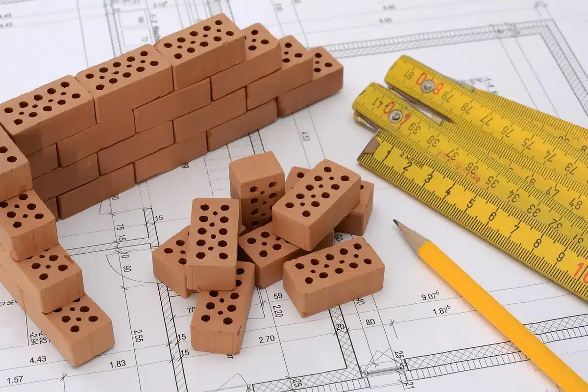Assorted polymer clay and sculpting tools on a bright work surface