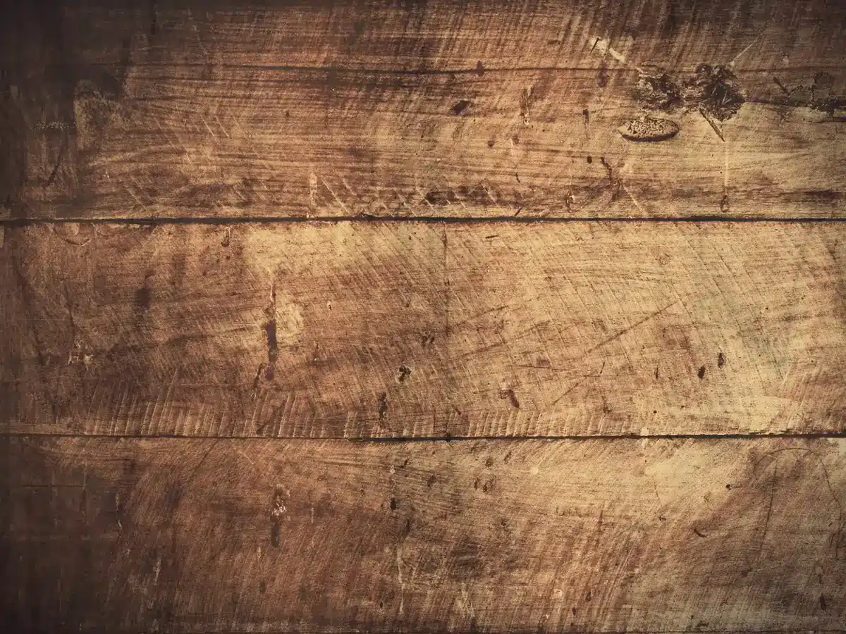 Hands assembling a wooden panel frame for an outdoor storage unit