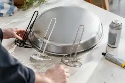 Dollar Tree hack: turn pizza pans and paper towel holders into a chic plant stand