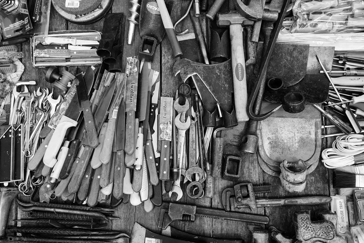 Foam sheets, scissors and utility knife laid out for upholstery