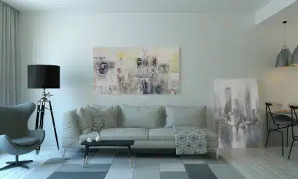 Wood slat shelving divider behind a sofa in a sunlit living room