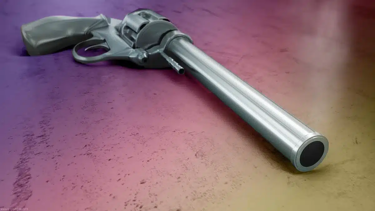 Close-up of hands holding a compact glue gun showing pistol grip and precision tip