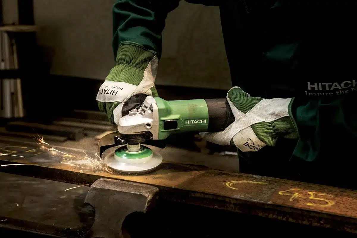 Bench grinder producing sparks at a workshop (illustration of noise and sparks)