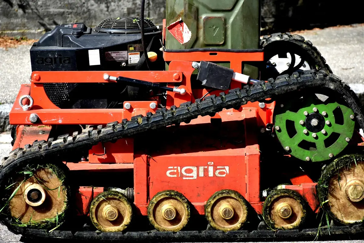 A compact Ariens-style zero-turn mower on a residential lawn
